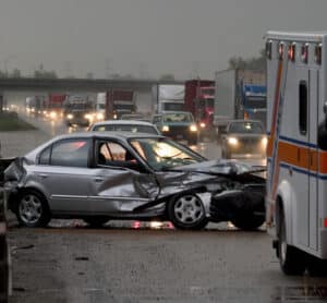 Car crash on a highway during a cloudy day.