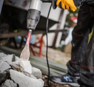 Power tool drilling cement.