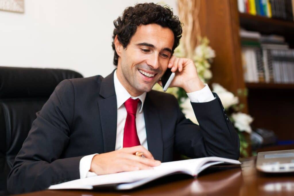 lawyer on the phone with client compass law group