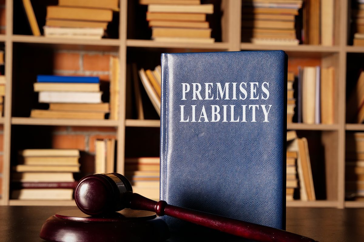 premises liability textbook in library with gavel