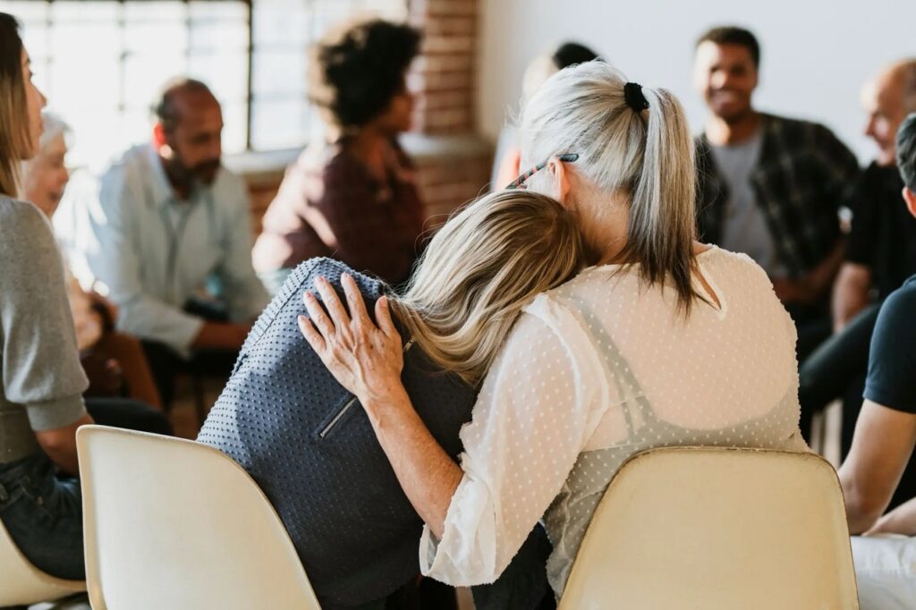 older woman consoling younger woman