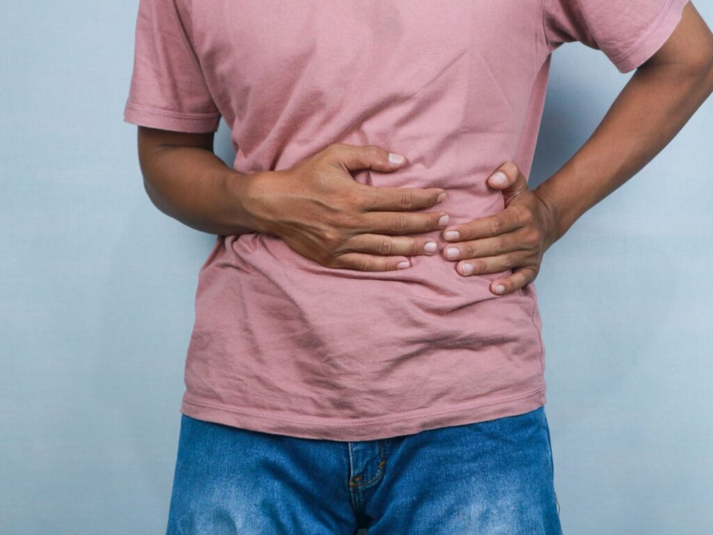 woman holding their side