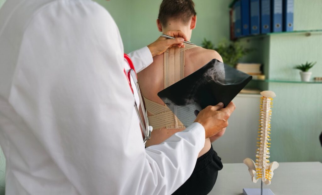 doctor diagraming x ray