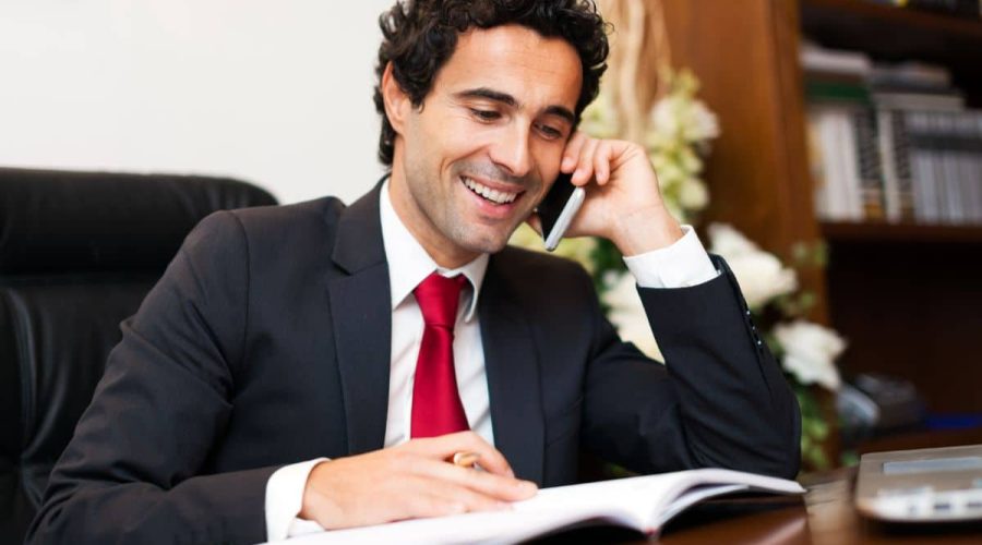lawyer on the phone with client compass law group